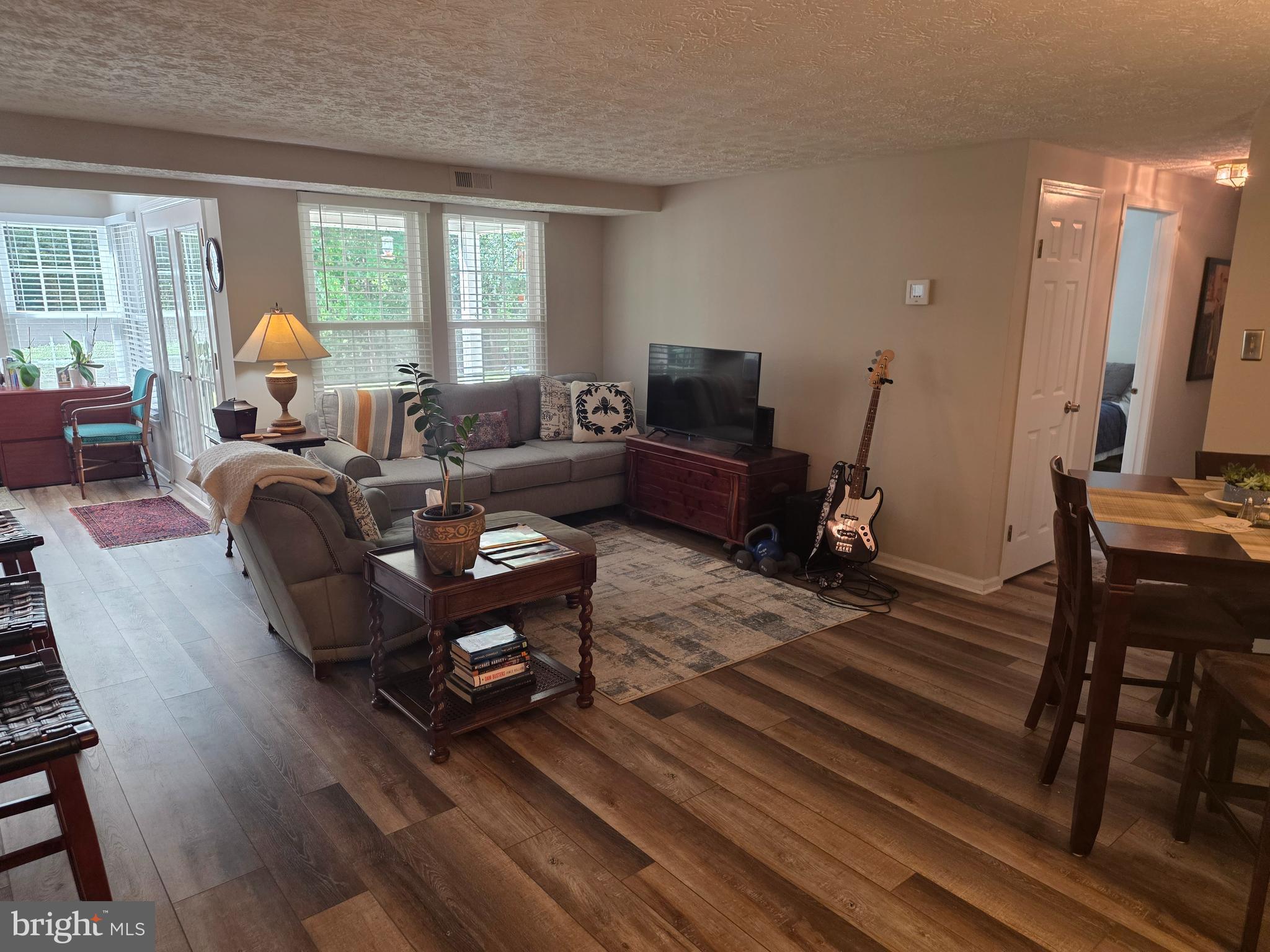 628 Southern Hills Drive, Unit B Arnold, MD 21012 - Photo 6 of 23 a living room with furniture a flat screen tv and a large window