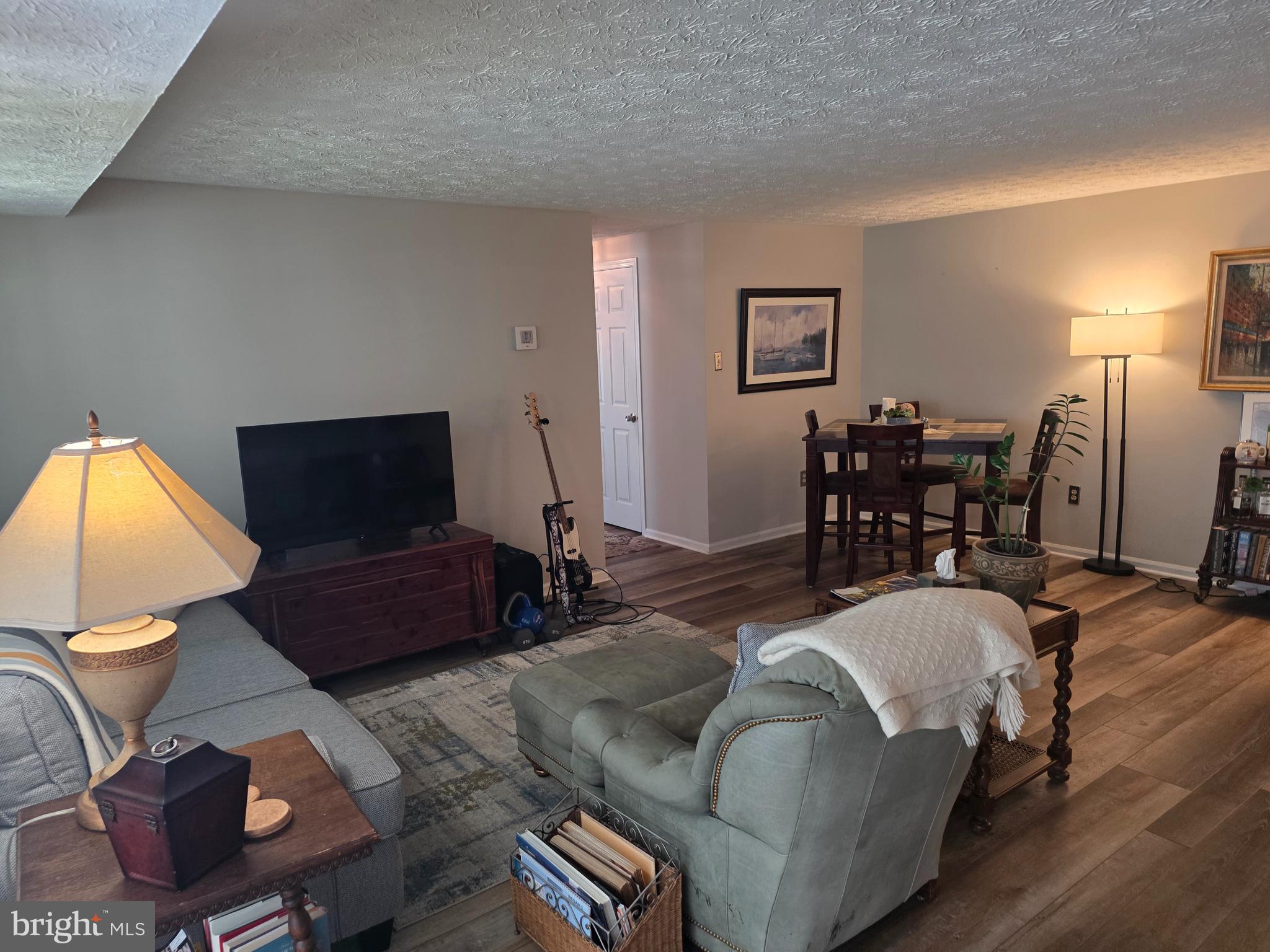 628 Southern Hills Drive, Unit B Arnold, MD 21012 - Photo 8 of 23 a living room with furniture and a flat screen tv