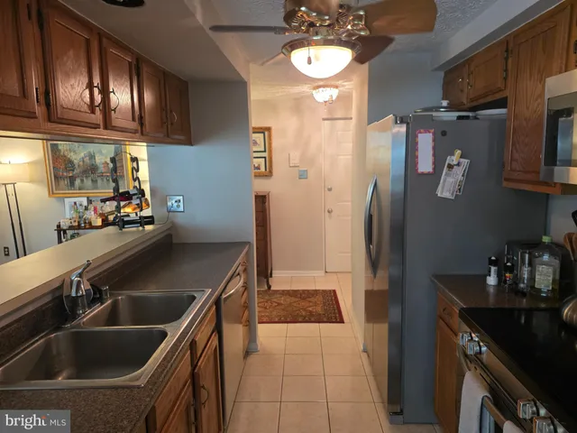 a kitchen with a sink cabinets and appliances