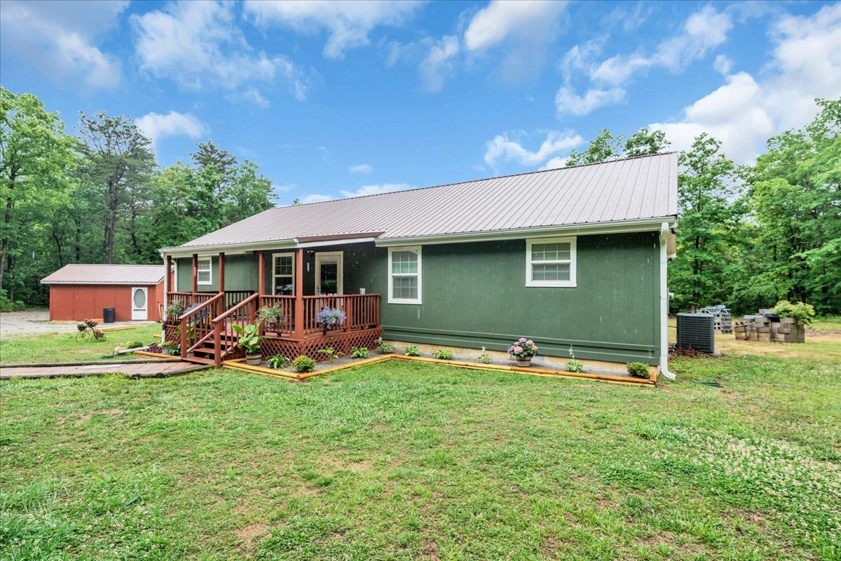 802 Meyers Road Altamont, TN 37301 - Photo 3 of 30 a backyard of a house with table and chairs