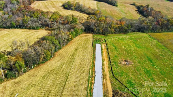 a blue swimming pool with a yard