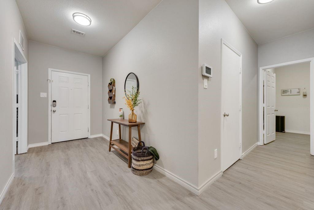 313 Citrus Drive Fate, TX 75189 - Photo 2 of 12 a view of a room with wooden floor gym equipment