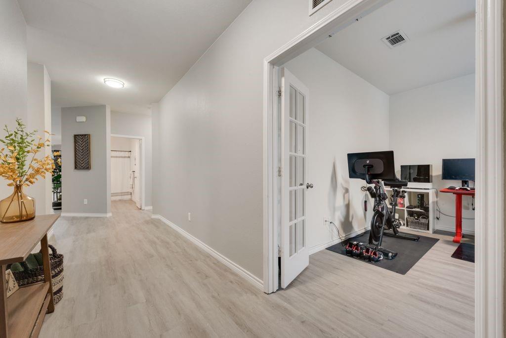 313 Citrus Drive Fate, TX 75189 - Photo 3 of 12 a view of a workspace with furniture and a flat screen tv