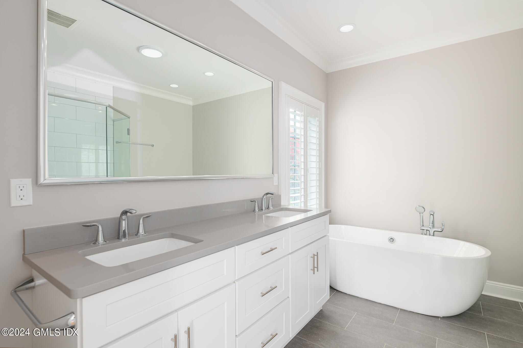 550 River Road Cos Cob, CT 06807 - Photo 13 of 32 a bathroom with a sink double vanity granite tub and a mirror