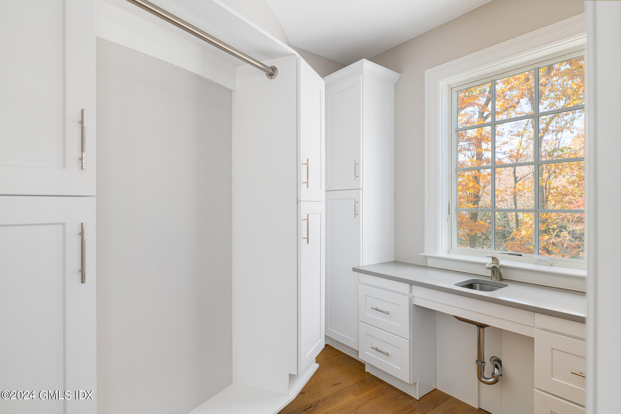550 River Road Cos Cob, CT 06807 - Photo 15 of 32 a view of cabinets a sink and dishwasher with wooden floor