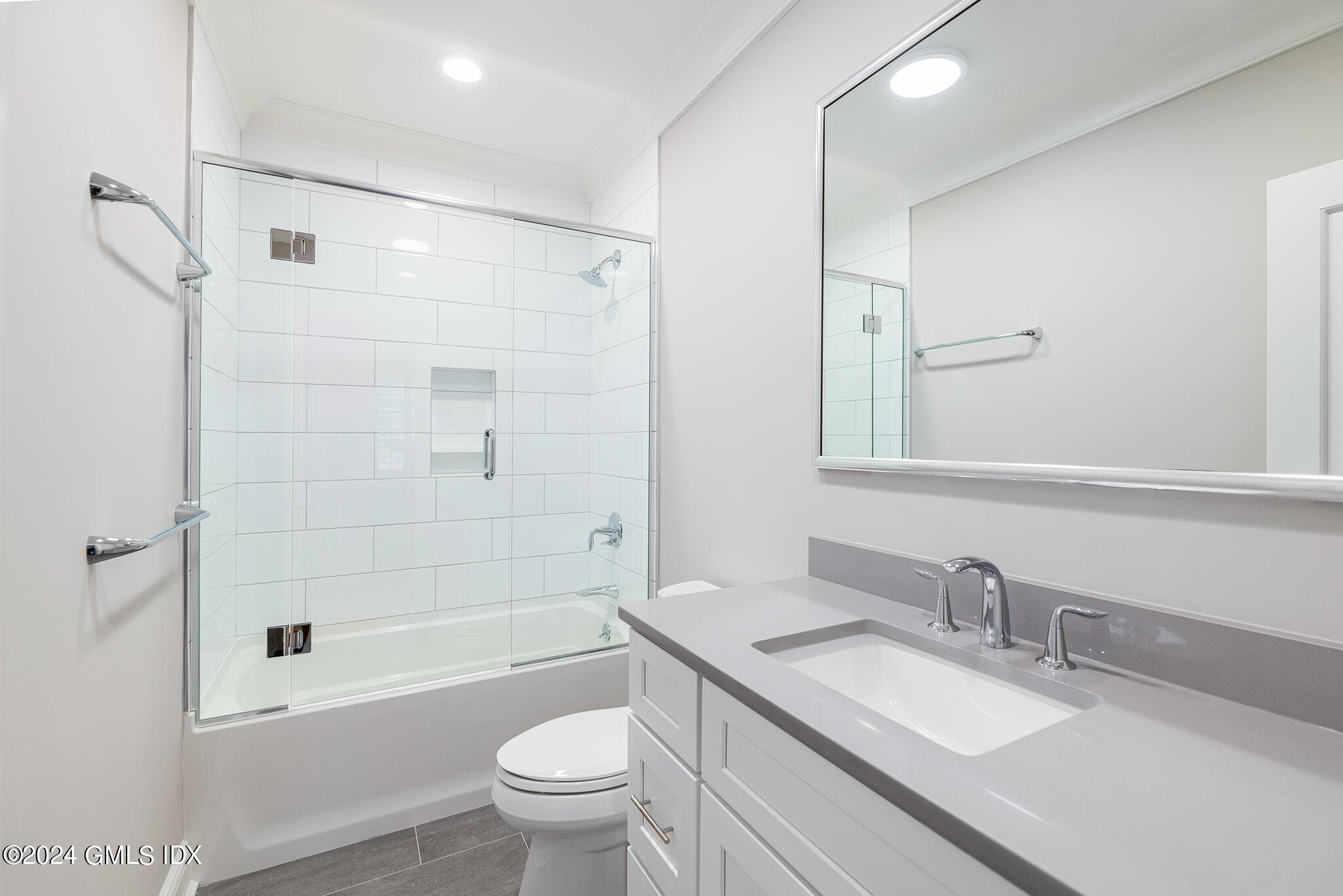 550 River Road Cos Cob, CT 06807 - Photo 21 of 32 a bathroom with a granite countertop sink a toilet and shower