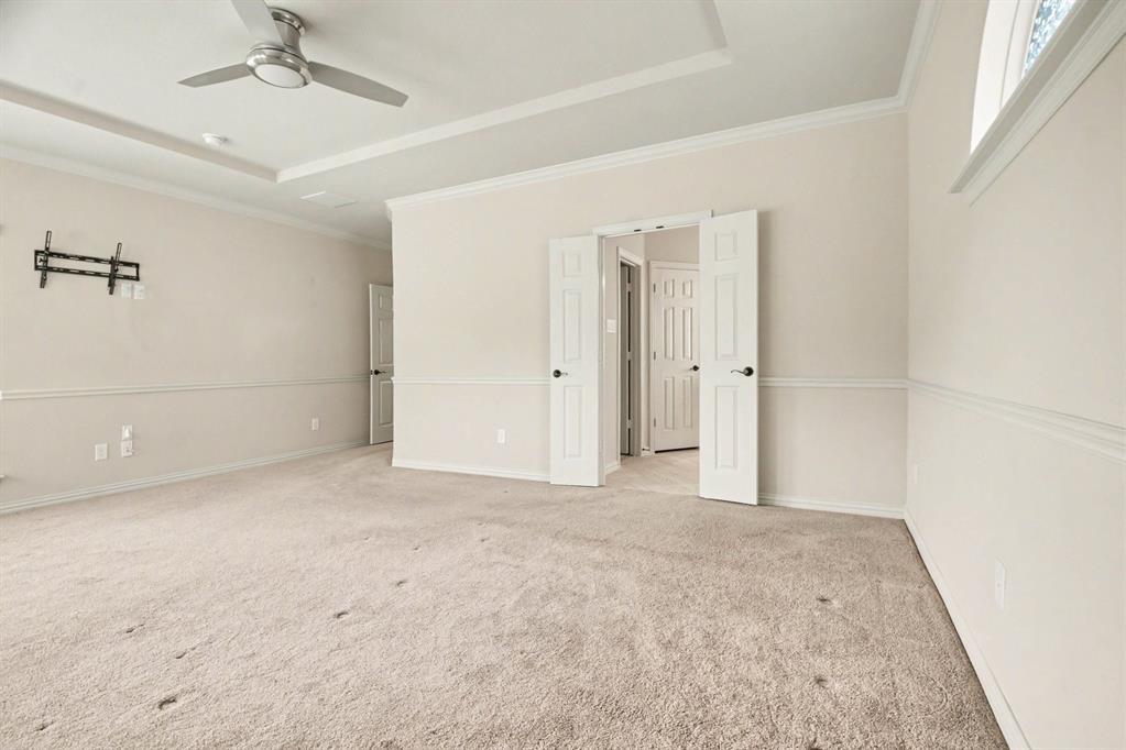 708 Yarrow Street Little Elm, TX 75068 - Photo 12 of 26 an empty room with fan and entrance