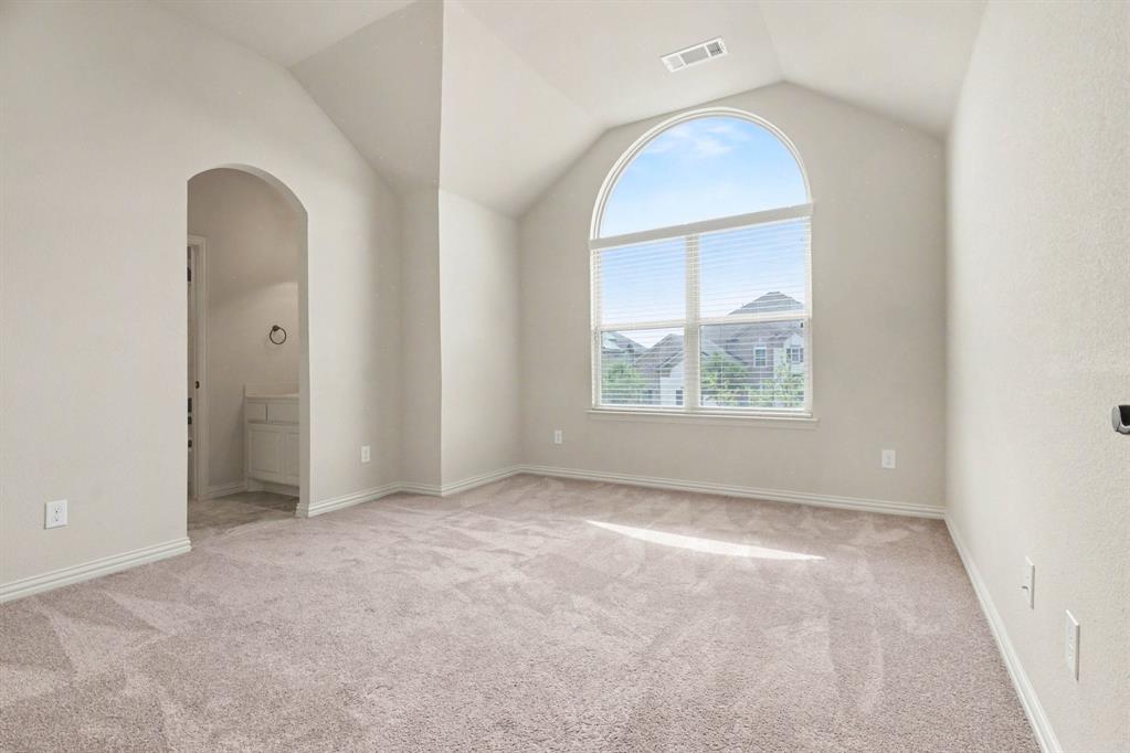 708 Yarrow Street Little Elm, TX 75068 - Photo 18 of 26 an empty room with windows and closet