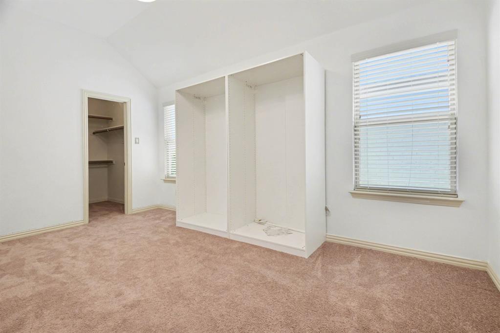 708 Yarrow Street Little Elm, TX 75068 - Photo 21 of 26 an empty room with windows and closet