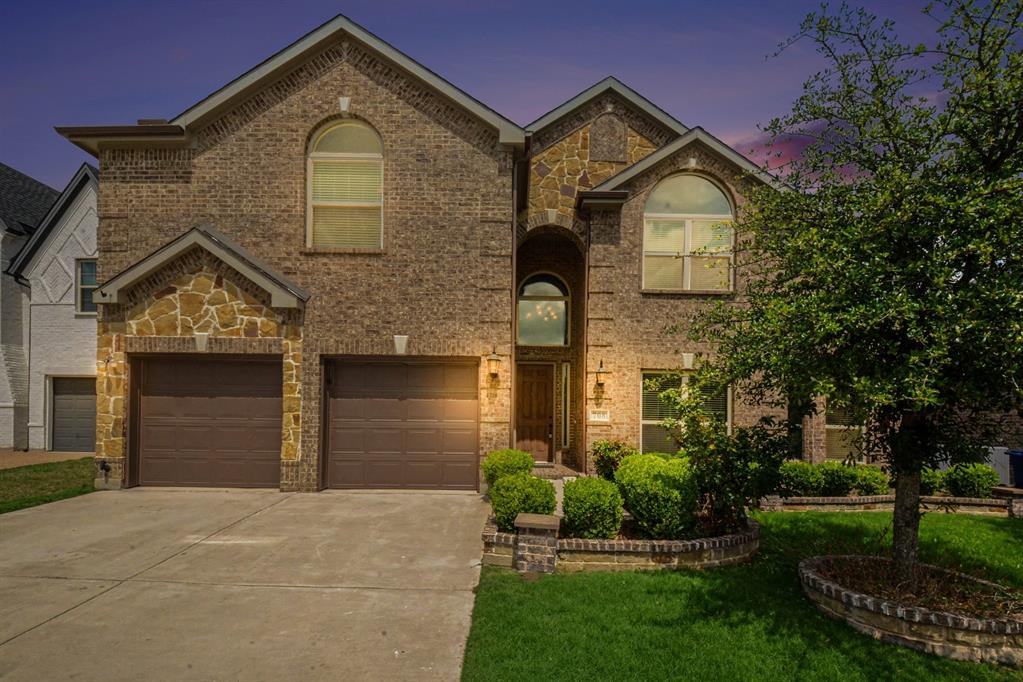 708 Yarrow Street Little Elm, TX 75068 - Photo 26 of 26 a front view of a house with a yard and garage