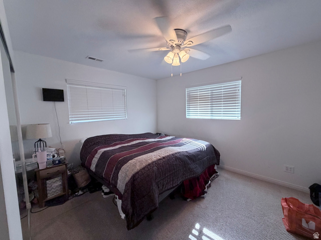 2855 South 1000 West Perry, UT 84302 - Photo 98 of 142 Bedroom with carpet floors and ceiling fan