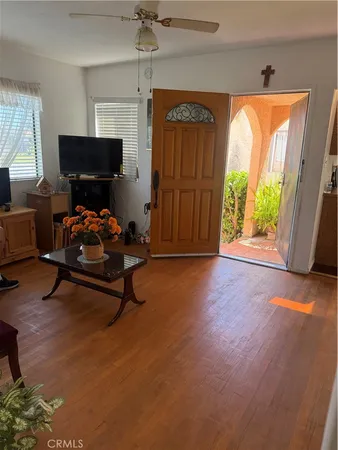 a living room with furniture and a window