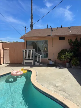 a view of a backyard with a garden and plants