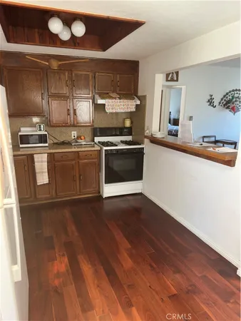 a kitchen with a sink and a stove top oven
