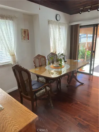 a white toilet sitting next to a bath tub