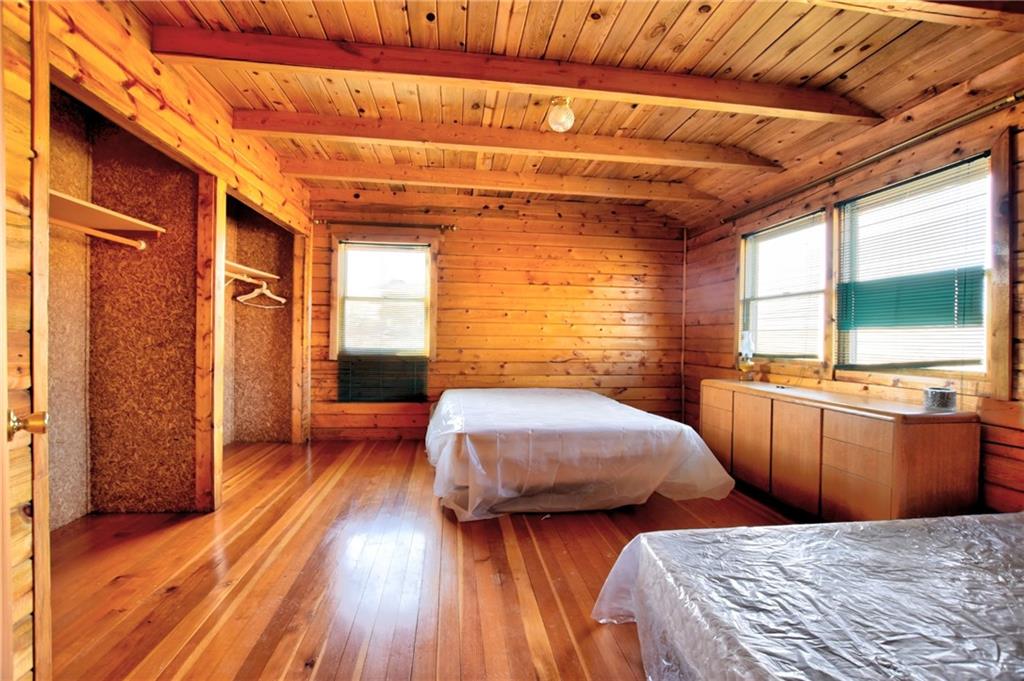 1930 Routt Road Hartsel, CO 80449 - Photo 11 of 23 a bedroom with two beds and a window