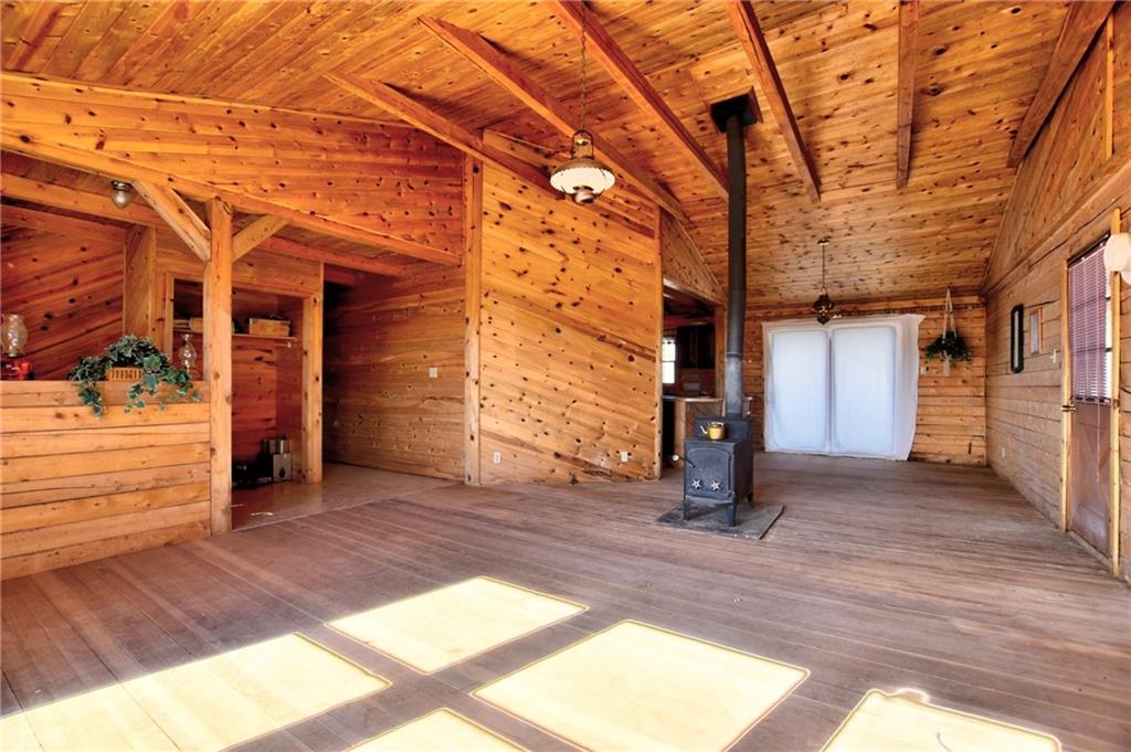 1930 Routt Road Hartsel, CO 80449 - Photo 6 of 23 a view of a porch with wooden floor and a yard