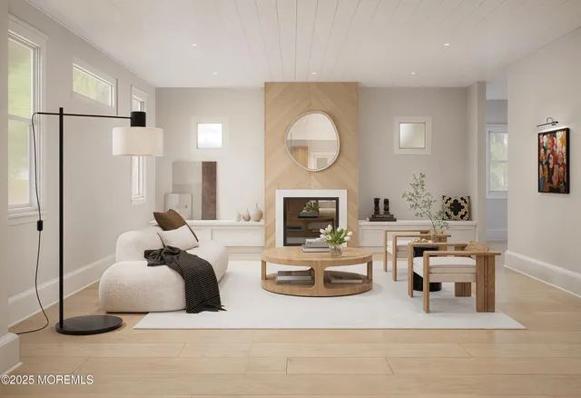 a living room with fireplace furniture and a fireplace