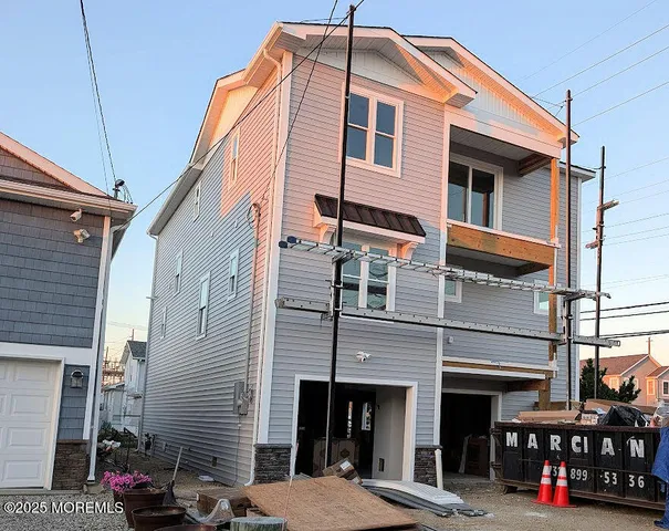 a front view of a building with many windows