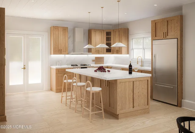 a kitchen with stainless steel appliances kitchen island granite countertop a refrigerator and a stove top oven