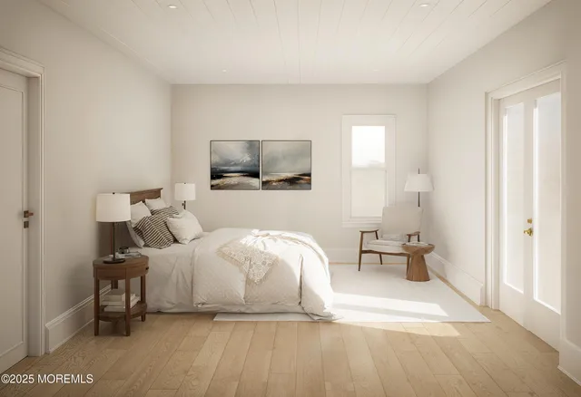 a bedroom with a bed and a tv