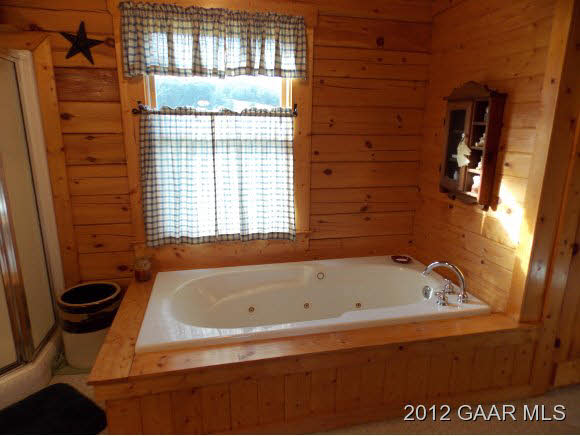 351 Summerdean Road Middlebrook, VA 24459 - Photo 13 of 19 a bathroom with a bathtub and a window