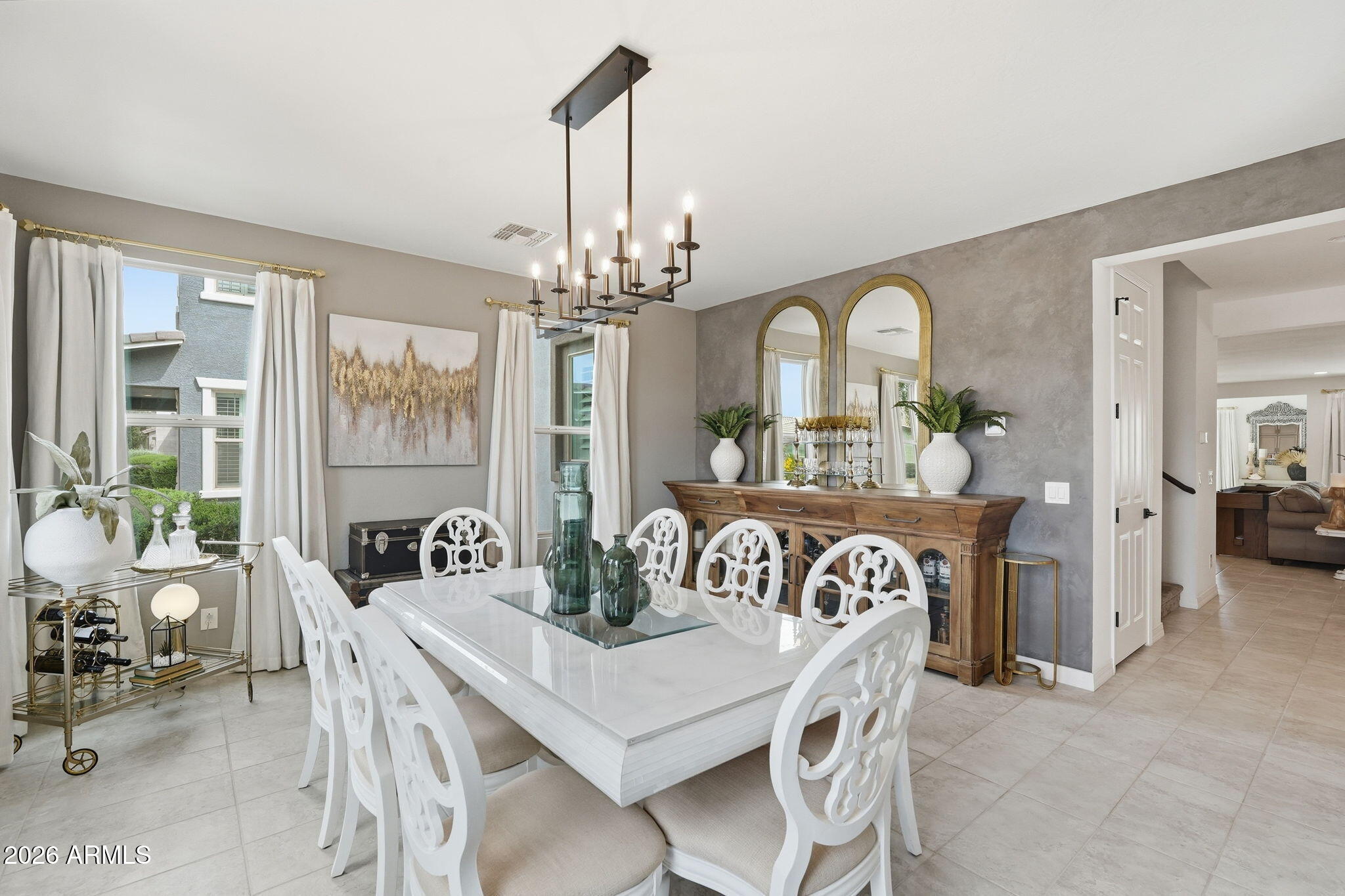 22607 East Russet Road Queen Creek, AZ 85142 - Photo 13 of 64 a view of a dining room with furniture and a chandelier