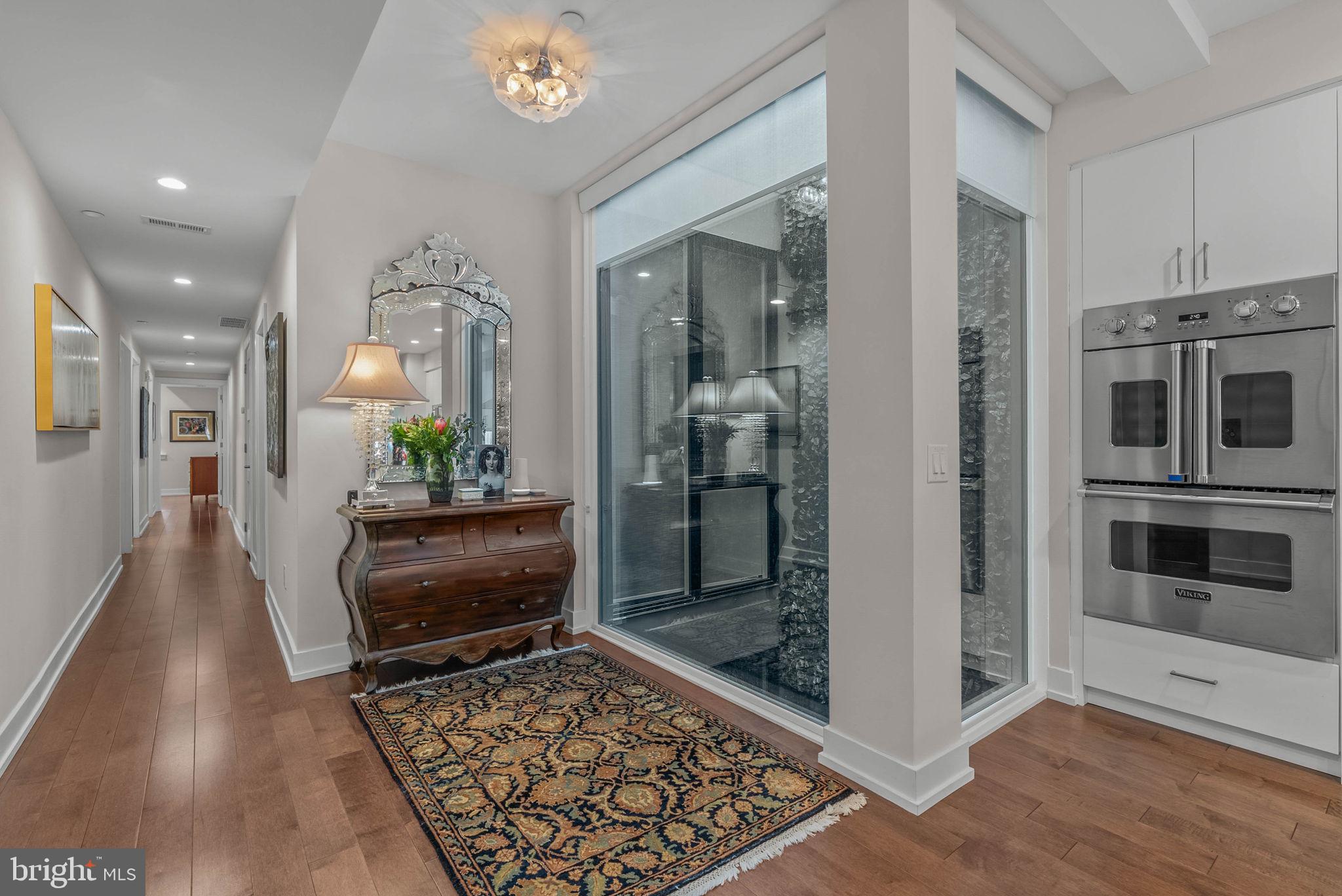 262 South 16th Street, Unit 4 Philadelphia, PA 19102 - Photo 26 of 30 a living room with stainless steel appliances furniture a rug and a view