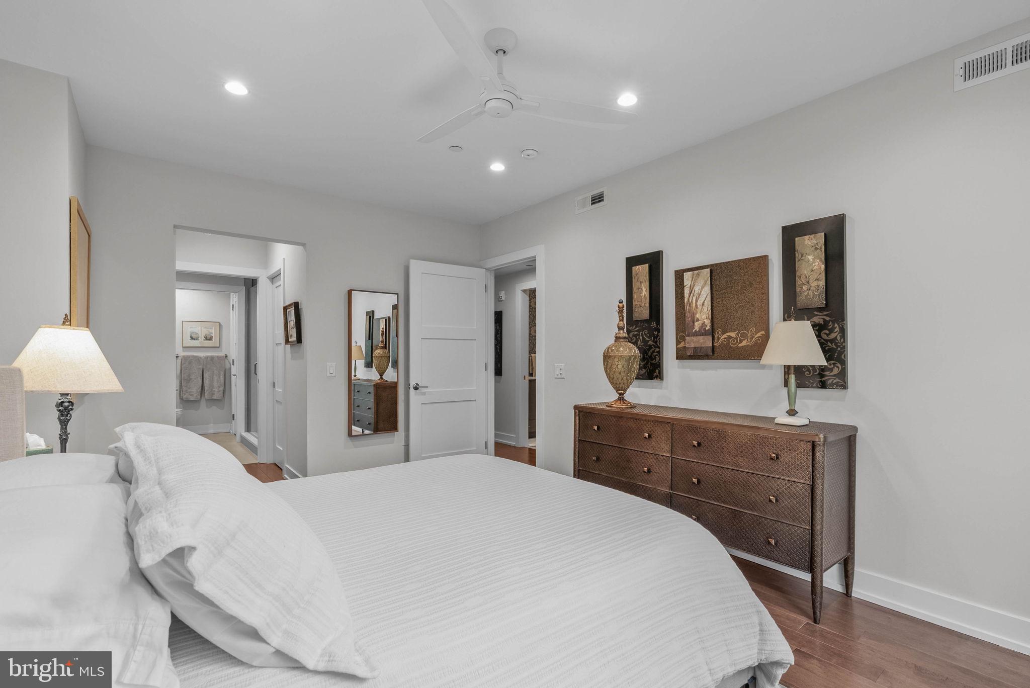 262 South 16th Street, Unit 4 Philadelphia, PA 19102 - Photo 9 of 30 a bedroom with a large bed and a flat screen tv