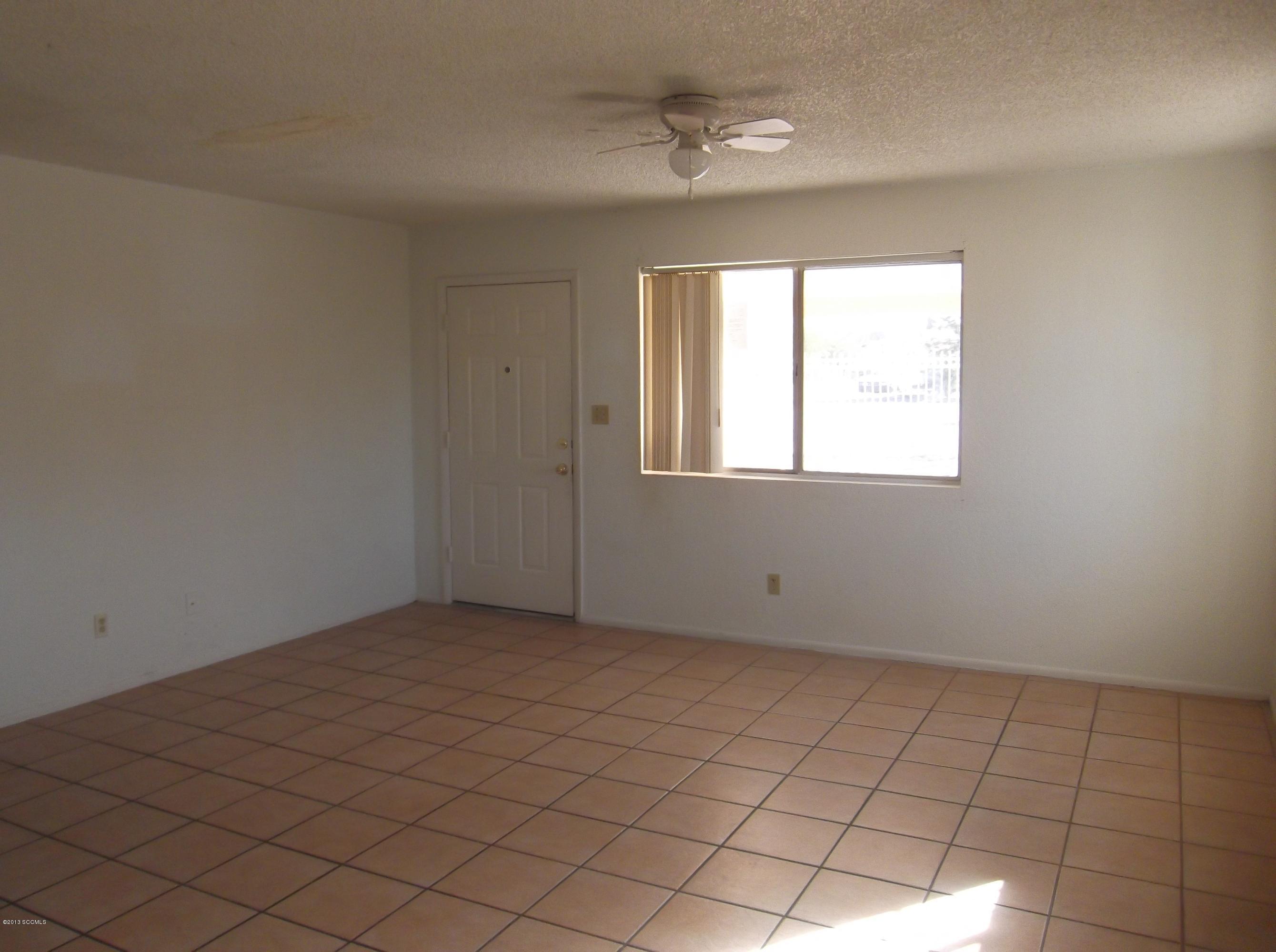 1241 Bellota Court Rio Rico, AZ 85648 - Photo 6 of 12 an empty room with windows
