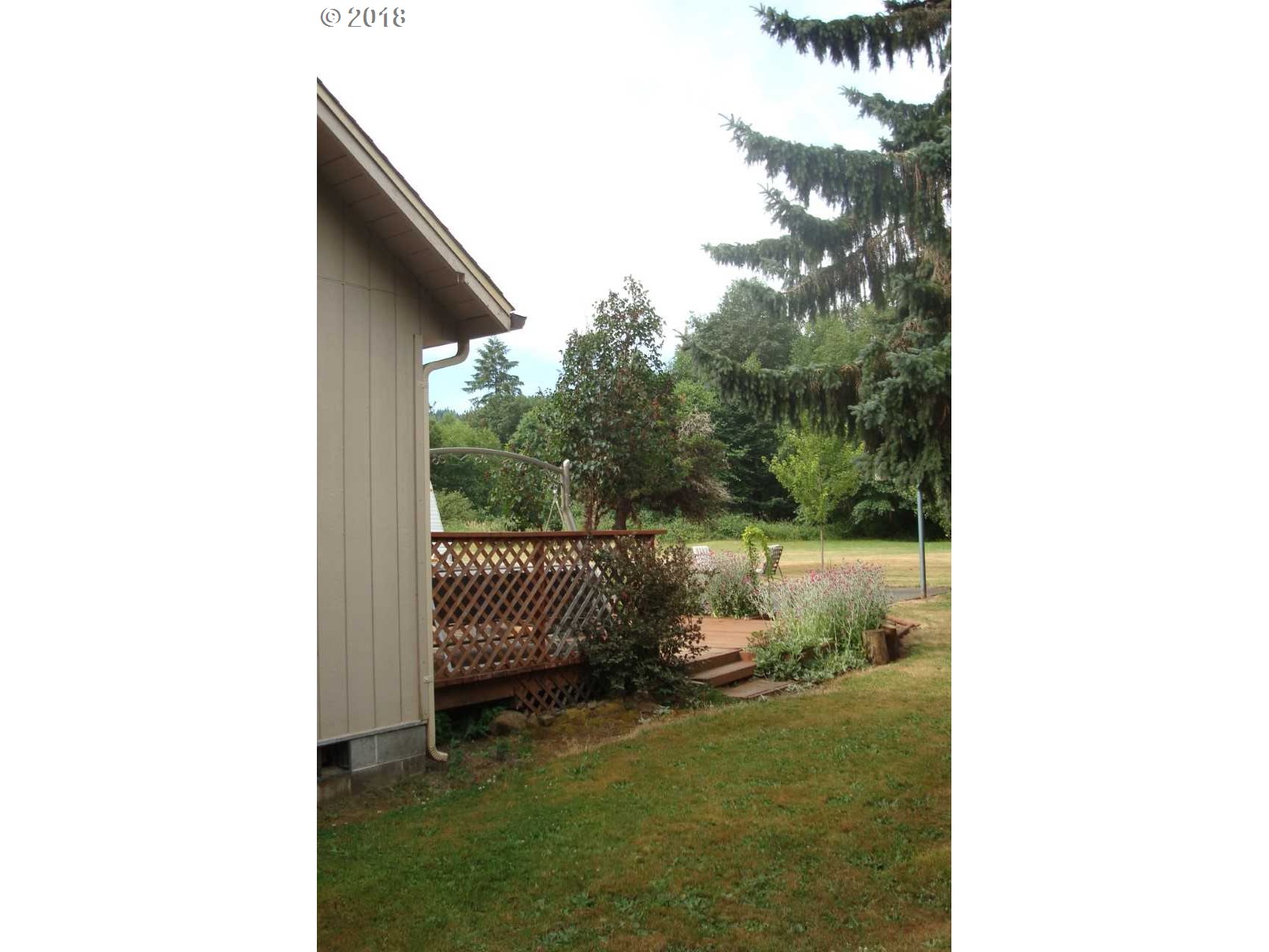 73995 Alder Grove Road Clatskanie, OR 97016 - Photo 3 of 11 a picture of a bench in the backyard of a house