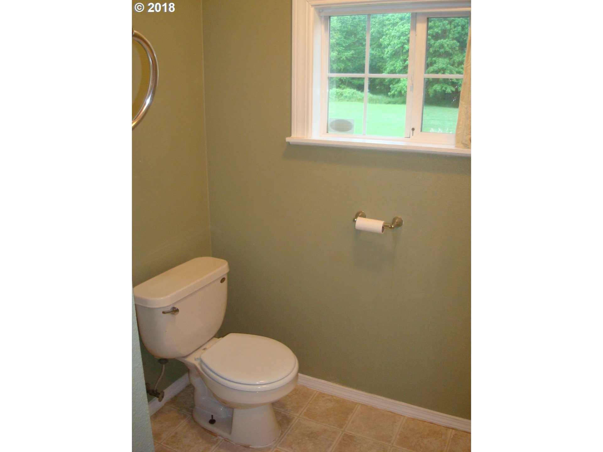 73995 Alder Grove Road Clatskanie, OR 97016 - Photo 4 of 11 a white toilet sitting next to a window