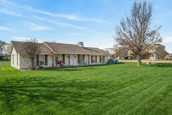 a view of a house with a big yard