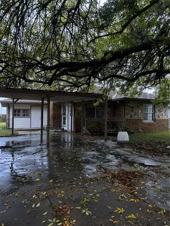 a front view of a house with sitting area