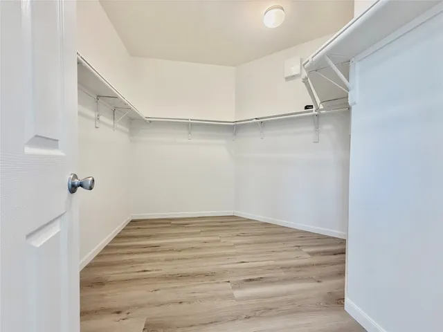 a view of an empty walk in closet