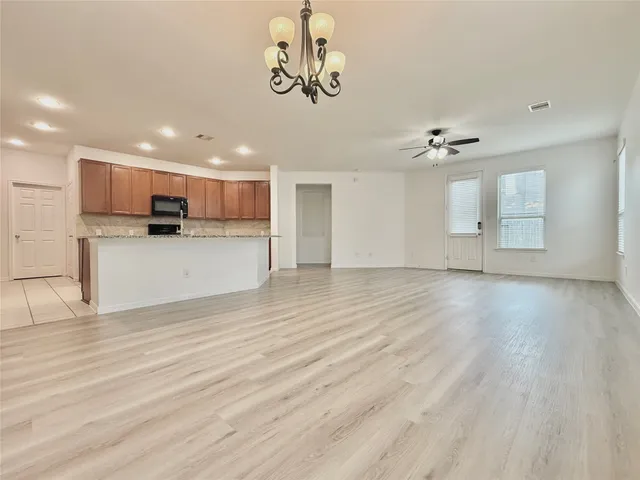 a view of a kitchen with a sink and cabinets