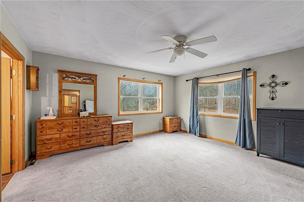 90 Montgomery Church Road Hillsdale, PA 15746 - Photo 13 of 25 a bed room with a bed and a tv