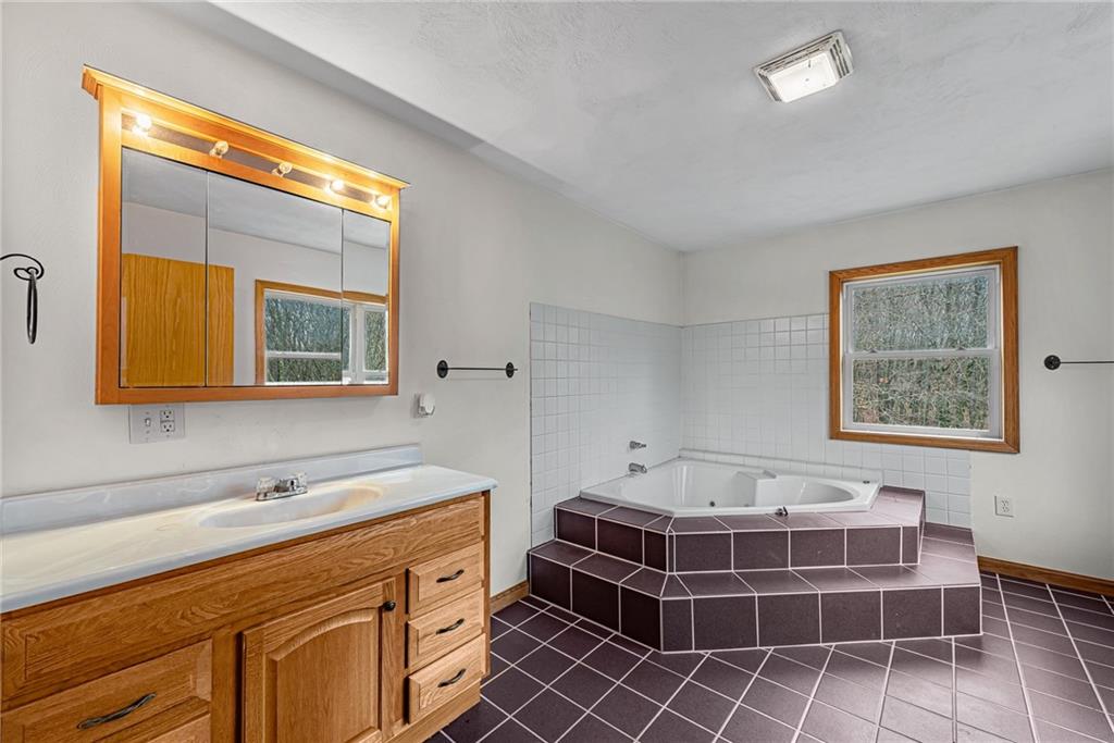 90 Montgomery Church Road Hillsdale, PA 15746 - Photo 14 of 25 a bathroom with a sink and a mirror