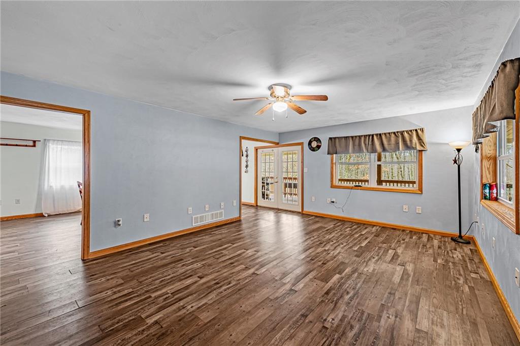 90 Montgomery Church Road Hillsdale, PA 15746 - Photo 2 of 25 a view of an empty room with window and wooden floor