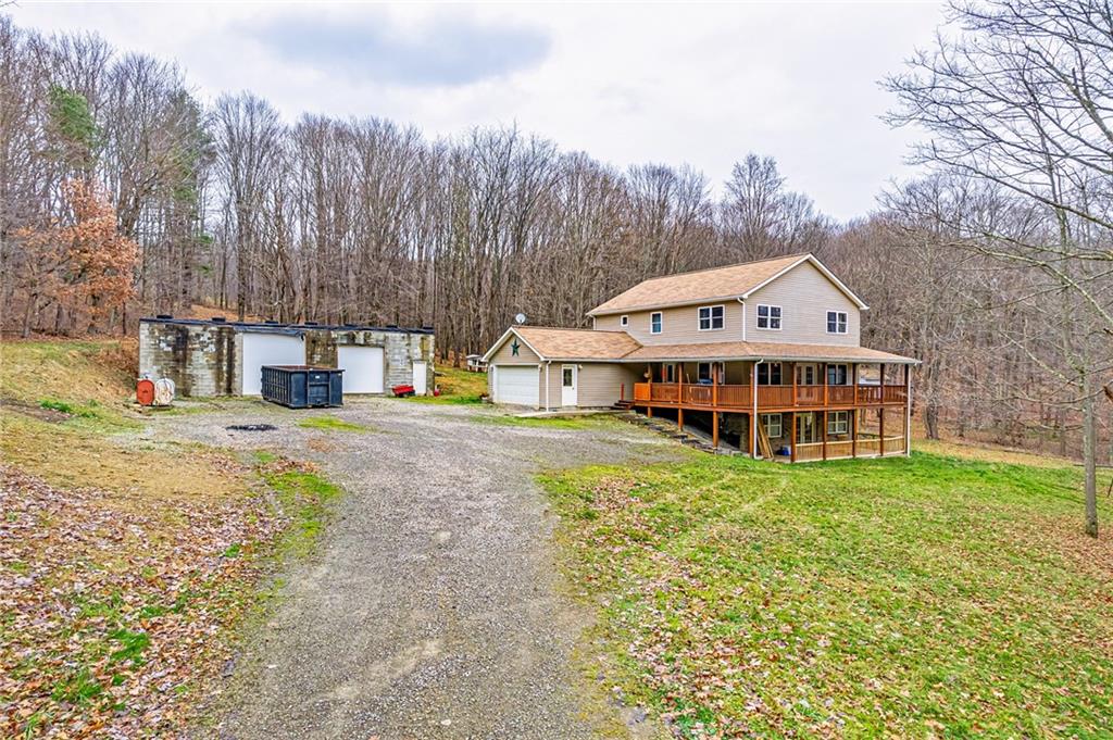 90 Montgomery Church Road Hillsdale, PA 15746 - Photo 21 of 25 a view of a house with pool and trees in the background