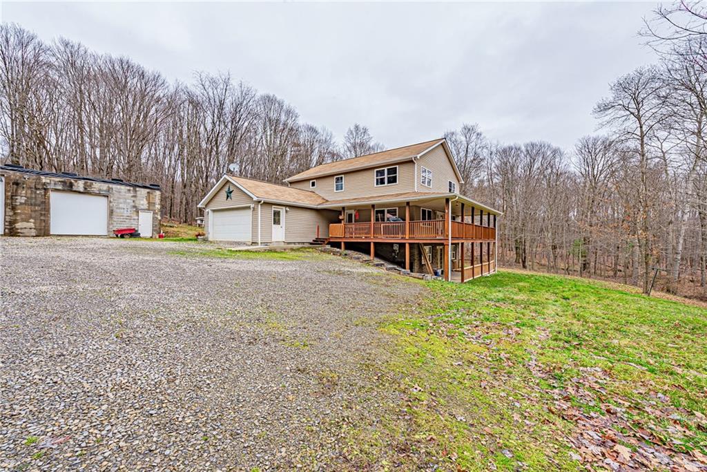 90 Montgomery Church Road Hillsdale, PA 15746 - Photo 22 of 25 a view of a house with a yard and balcony