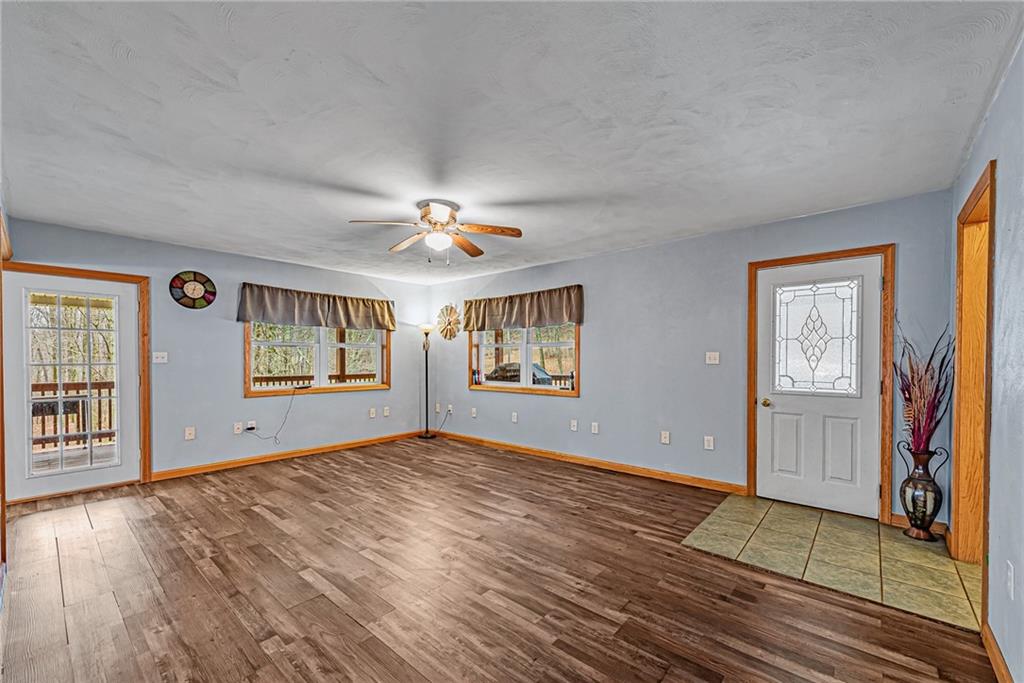 90 Montgomery Church Road Hillsdale, PA 15746 - Photo 3 of 25 a view of an empty room with window and wooden floor