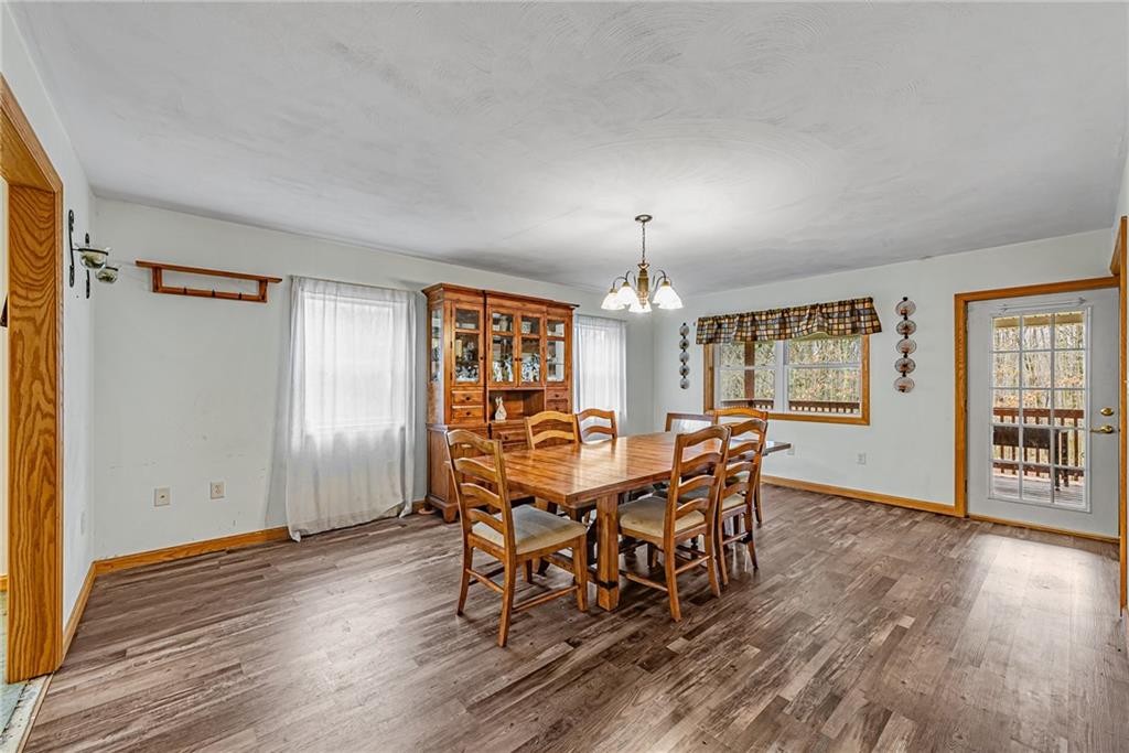 90 Montgomery Church Road Hillsdale, PA 15746 - Photo 6 of 25 a view of a dining room with furniture and wooden floor