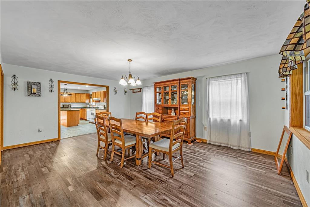 90 Montgomery Church Road Hillsdale, PA 15746 - Photo 7 of 25 a view of a dining room with furniture and wooden floor