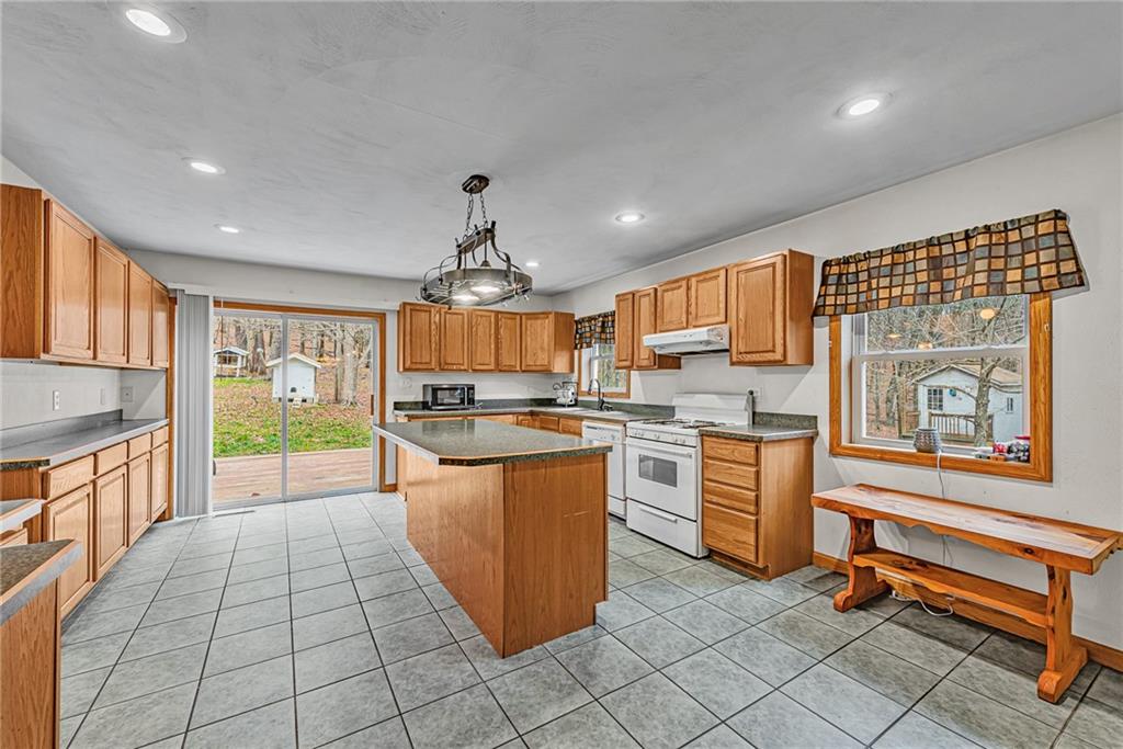 90 Montgomery Church Road Hillsdale, PA 15746 - Photo 8 of 25 a kitchen with stainless steel appliances granite countertop a stove and cabinets