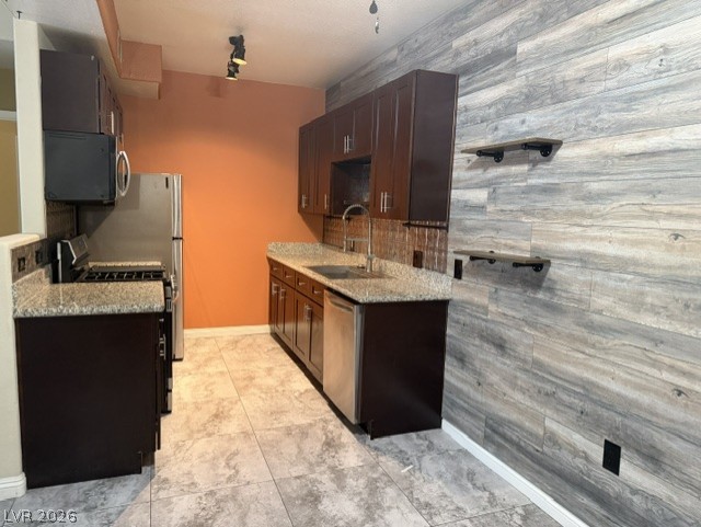 3318 North Decatur Boulevard, Unit 1163 Las Vegas, NV 89130 - Photo 17 of 35 A well-appointed kitchen features rich cabinetry, granite countertops, and modern appliances.