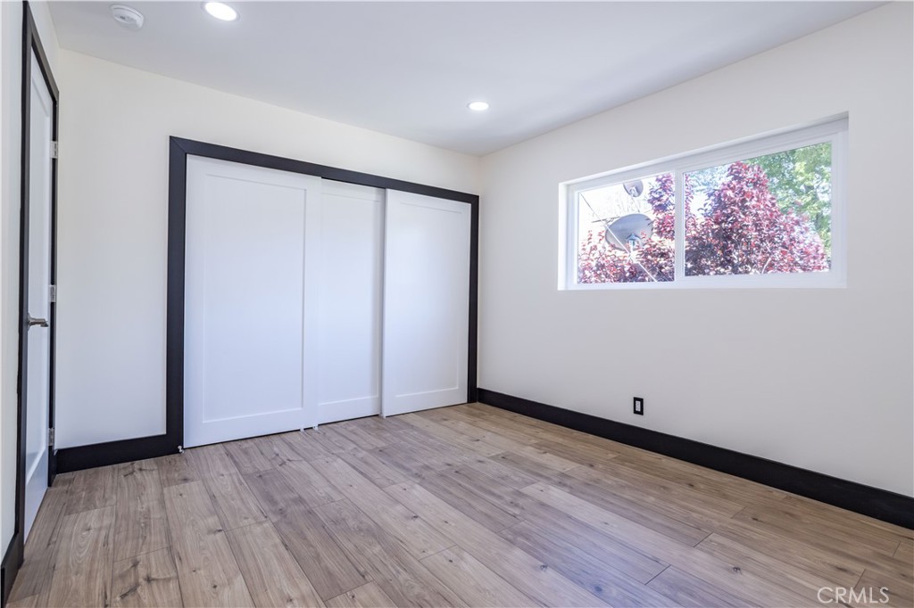 42640 Ranch Club Road Lake Hughes, CA 93532 - Photo 10 of 27 a view of an empty room with wooden floor and closet