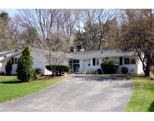 12 Ruth Drive Framingham, MA 01701 - Photo 1 of 10 a view of a house with a yard and large trees