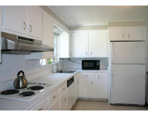 12 Ruth Drive Framingham, MA 01701 - Photo 4 of 10 a kitchen with appliances a sink and cabinets