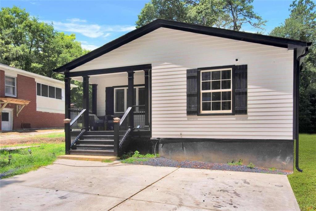 3401 Lake Valley Road Northwest Atlanta, GA 30331 - Photo 1 of 1 a view of a house with a yard
